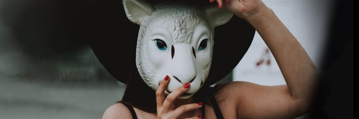 Woman wearing a sheep's mask