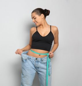 Woman measuring waist